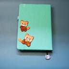 red panda embroidered patch sticker on a notebook cover
