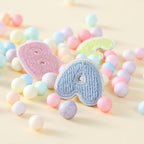 pastel macaroon mini alphabet embroidered patch close-up detail