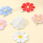 peel-and-stick backing of cosmos flower embroidered patch
