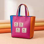 vintage french flower stamp embroidered stick-on patches on a pink orange and blue color-block tote bag
