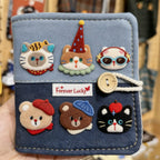 vintage chenille cat and bear embroidered patches on a denim card holder
