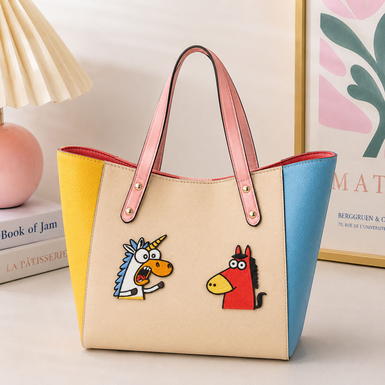 funny meme horse and unicorn embroidered patches on a cream color-block leather tote bag