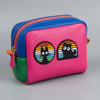 black cat in rainbow window embroidered stick-on patches on a colorful color-block leather zip pouch