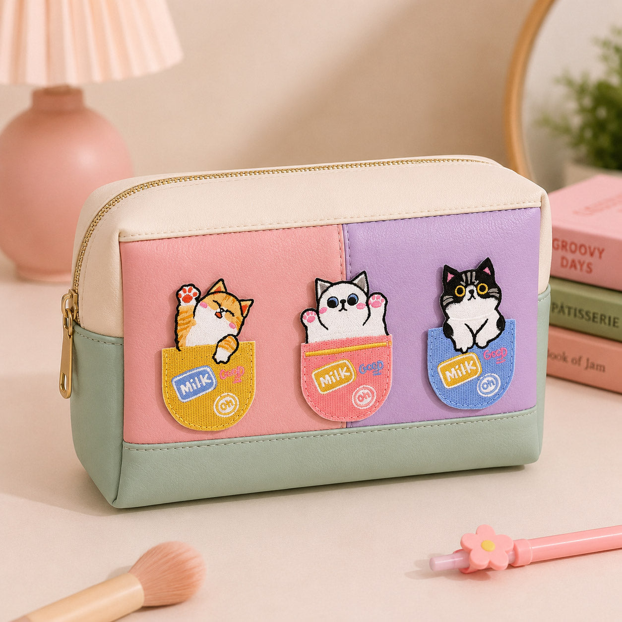 cute cats peeking out of milk pocket stick-on patches decorating a pink and purple color-block leather makeup bag