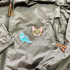 cute cartoon dinosaur embroidered stick-on patch on a hoodie