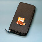 red panda patch sticker decorating a wallet