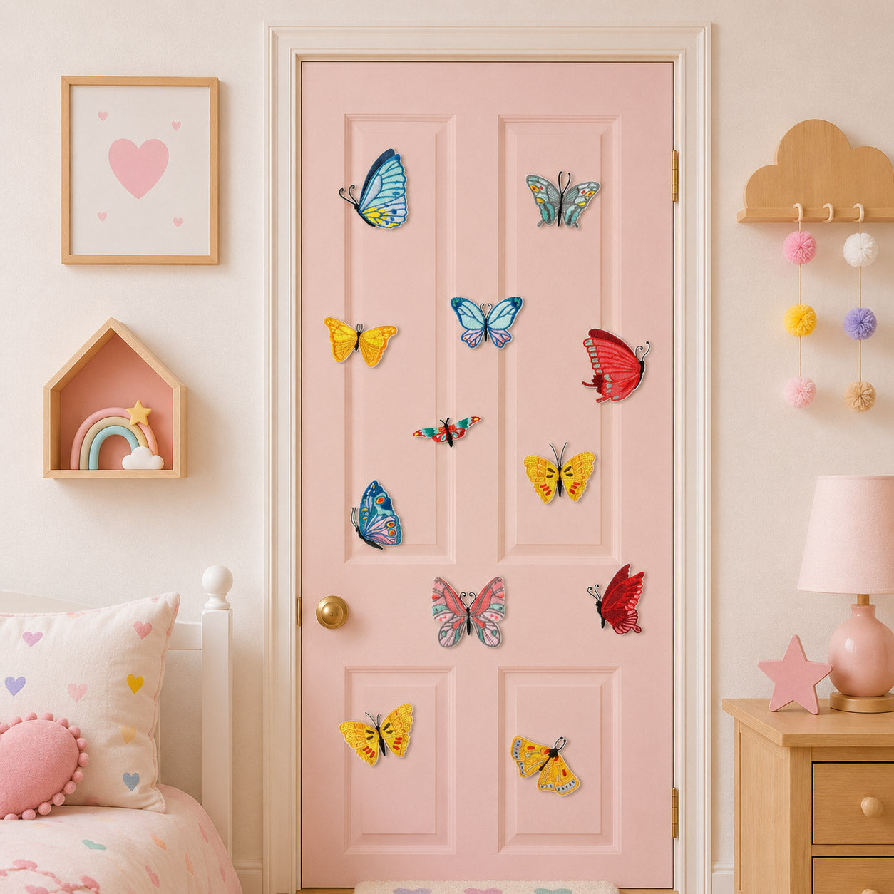 eleven vibrant embroidery butterfly patches in blue yellow red pink and green scattered on a pink bedroom door in a girls room