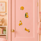 fluffy orange fox curled in a circle holding green scarf sitting upright and running with tail up stick-on patches on a pink door in a pastel room