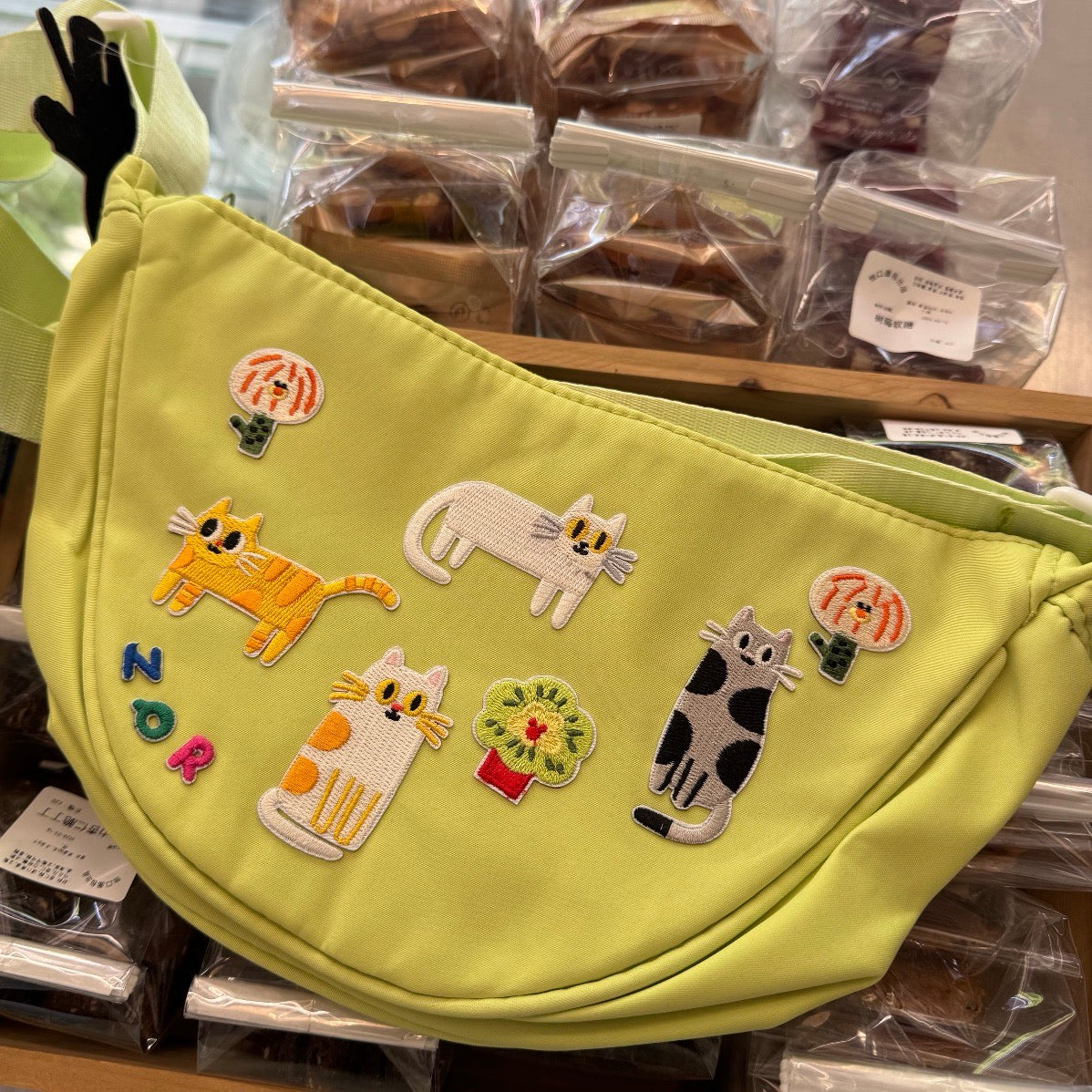 pastel botanical and sweet treats embroidered patches on crossbody bag