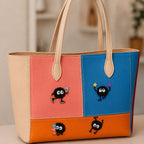 playful soot sprite embroidered stick-on patches on canvas tote bag