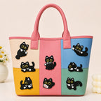 cozy black cat embroidered stick-on patch on tote bag