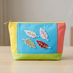 mini leaf embroidered stick-on patch on makeup pouch