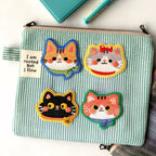 kawaii cat embroidered patches on a mint green striped canvas pencil case