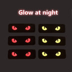glow-in-the-dark cat eye embroidered patch glowing in the dark — yellow and red cat eyes