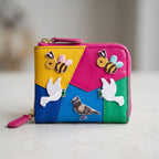 bee and dove embroidered patches on a colorblock leather zip coin wallet