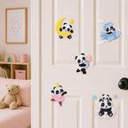 panda on crescent moon riding airplane holding daisies dancing ballet and sitting on cloud stick-on patches displayed on a white bedroom door