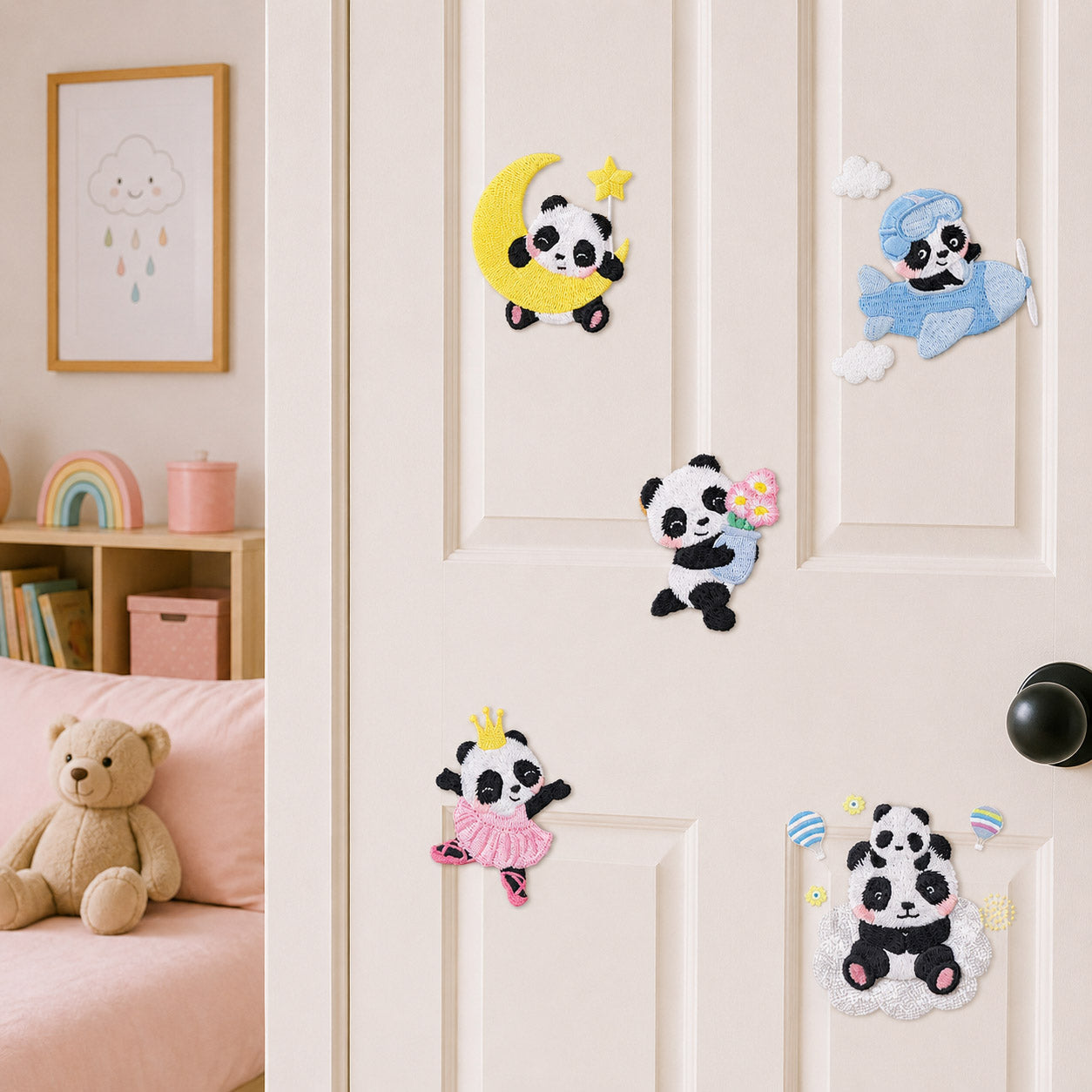 panda on crescent moon riding airplane holding daisies dancing ballet and sitting on cloud stick-on patches displayed on a white bedroom door
