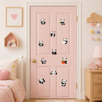 eleven adorable panda embroidered patches in various poses scattered on a pink door in a pastel girls bedroom