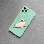 fluffy harp seal embroidered patch on a mint green phone case