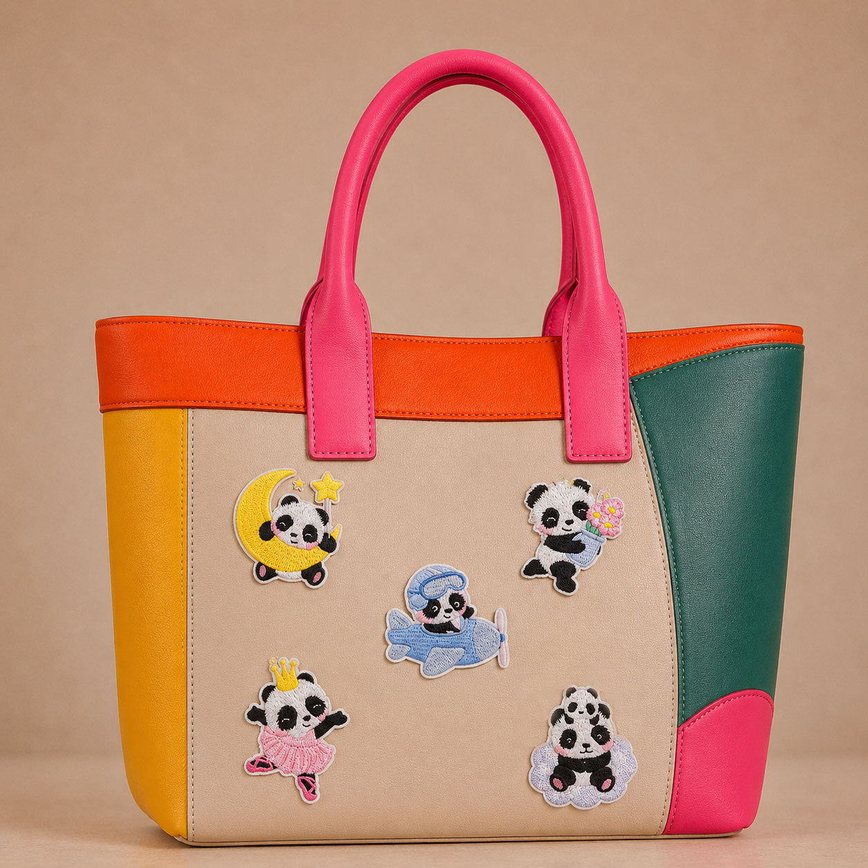 panda on moon in airplane with flowers in ballet dress stick-on patches decorating a pink and orange color-block leather handbag