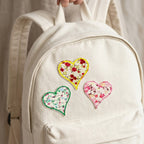 vintage ditsy floral heart stick-on embroidered patch on backpack
