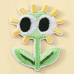 derpy green daisy googly eyes embroidered patch close-up detail