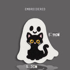 ghost hugging black cat embroidered stick-on patch — white kawaii ghost with pink blush embracing black cat with large round yellow eyes from behind
