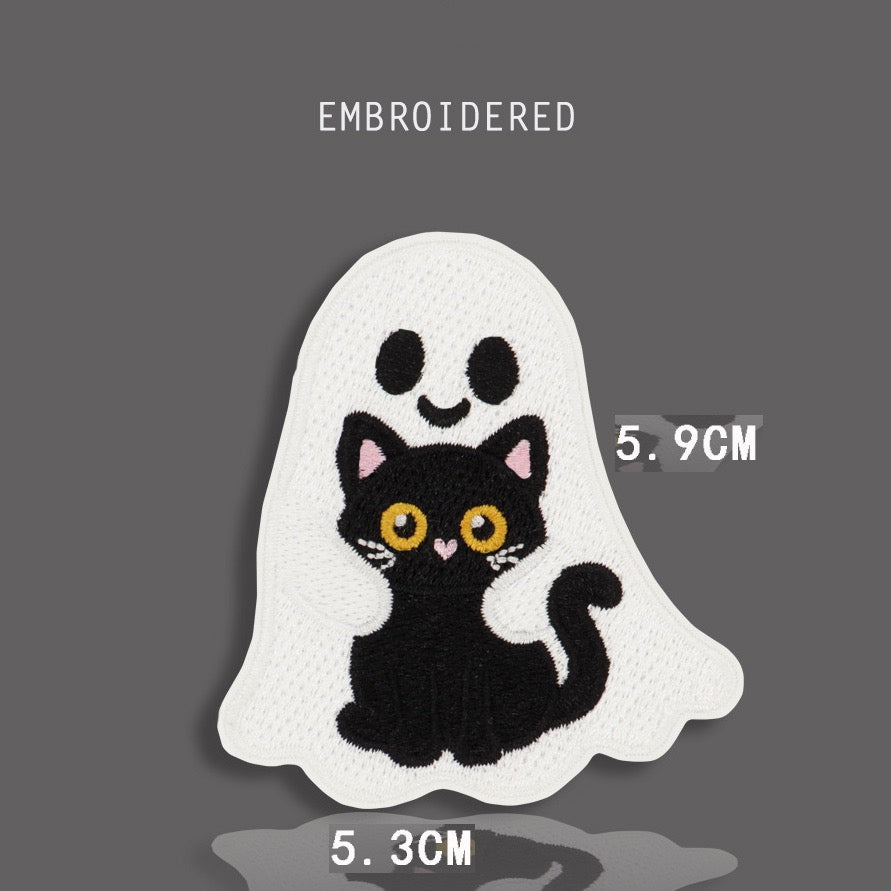 ghost hugging black cat embroidered stick-on patch — white kawaii ghost with pink blush embracing black cat with large round yellow eyes from behind