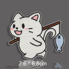 white cat holding fishing rod with small blue fish embroidered stick-on patch