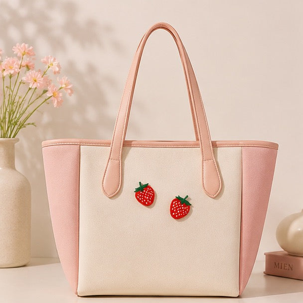 red strawberry embroidered stick-on patch on canvas tote bag