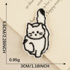 fluffy cat with raised tail kawaii black and white embroidered stick-on patch
