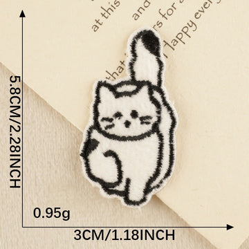 fluffy cat with raised tail kawaii black and white embroidered stick-on patch