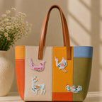 chinese crane deer bird and duck with floral motifs stick-on patches decorating a multicolor stripe leather handbag