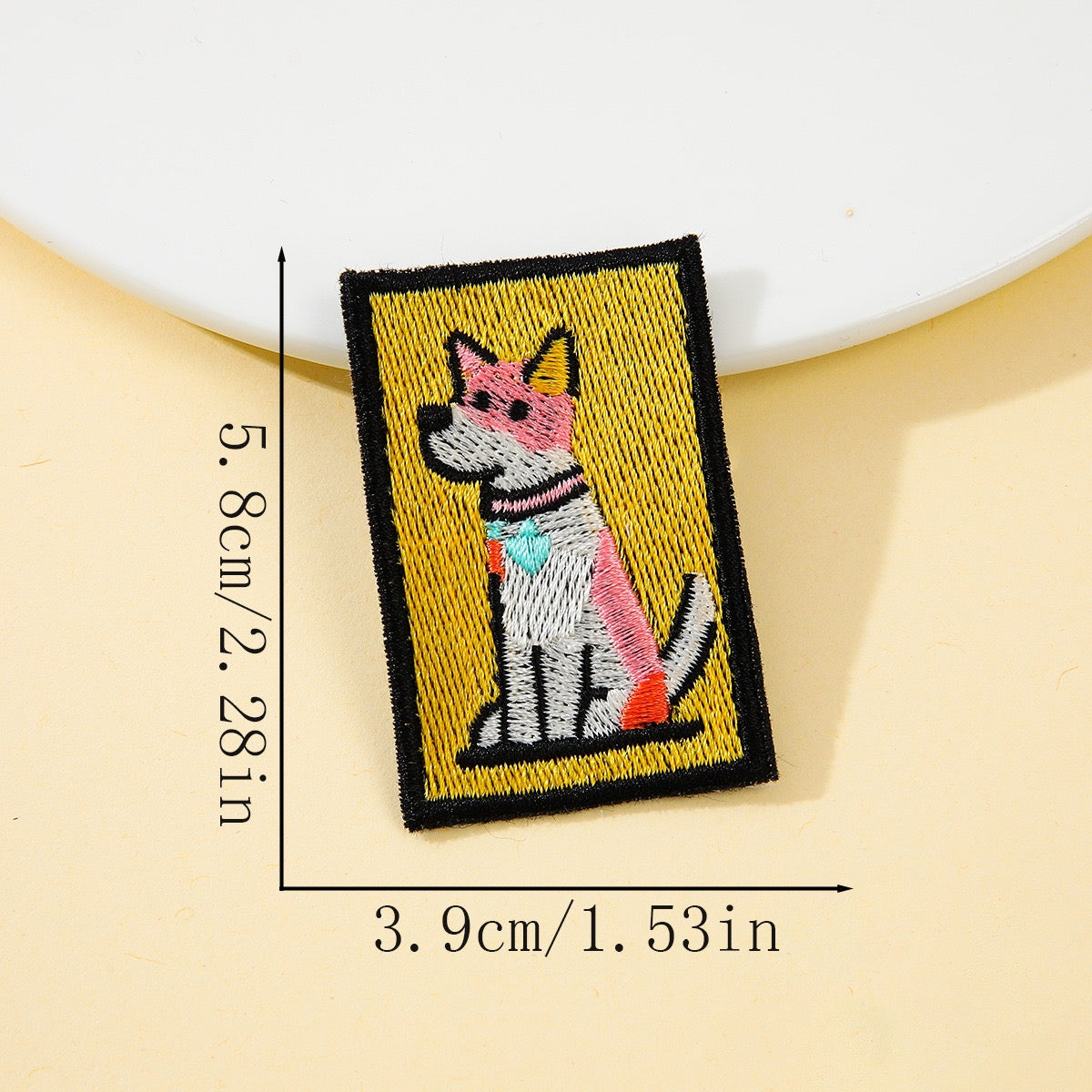 pink silhouette dog retro pop art embroidered stick-on patch on yellow background