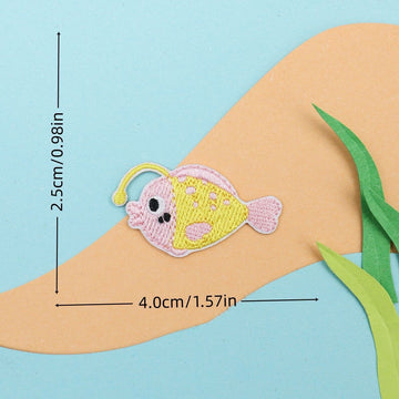 pink anglerfish embroidered stick-on patch — round spotted fish with glowing lure