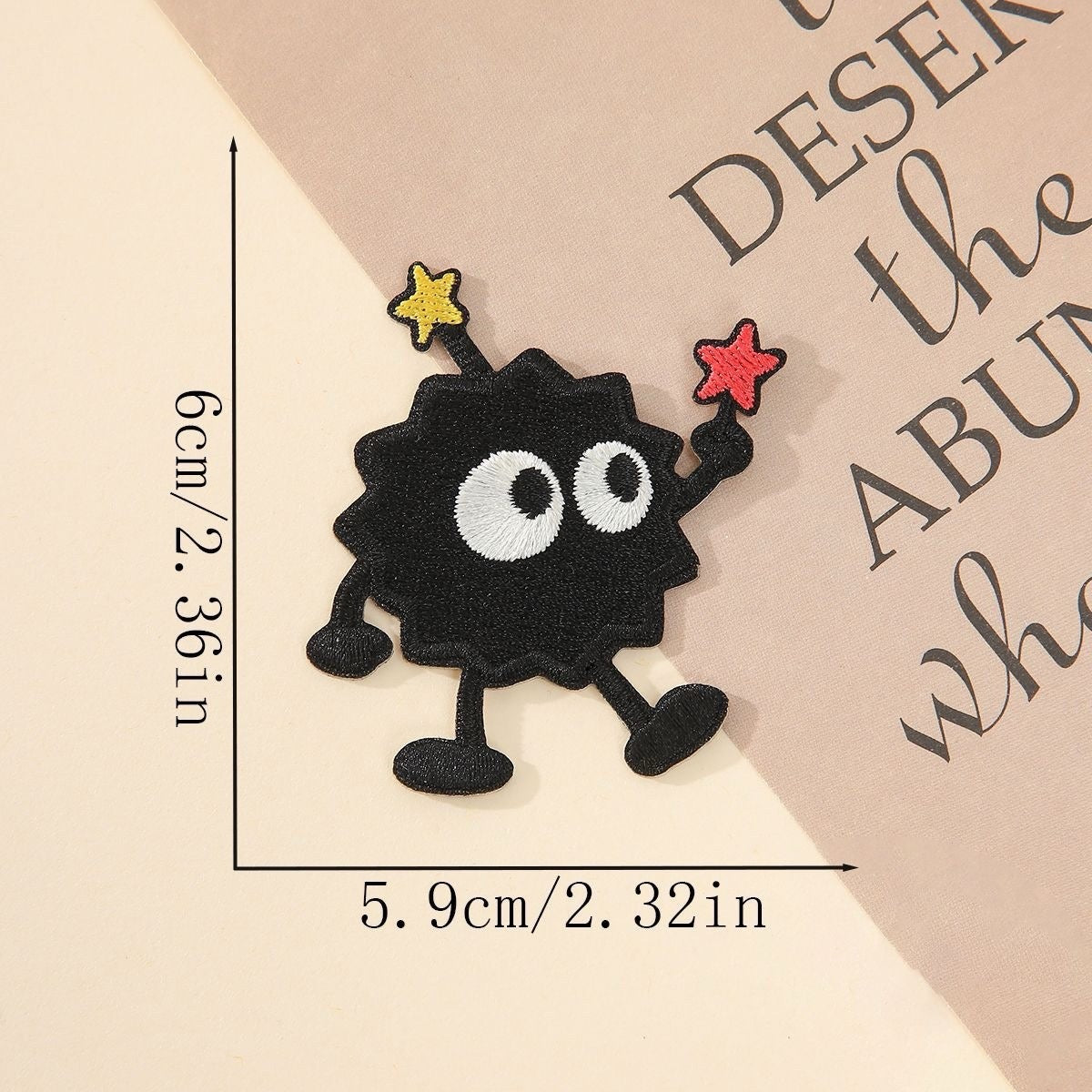 waving soot sprite embroidered patch with red and yellow stars