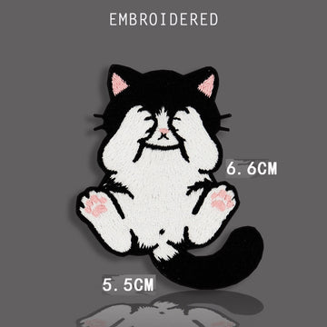 peek-a-boo tuxedo cat covering eyes with paws embroidered patch