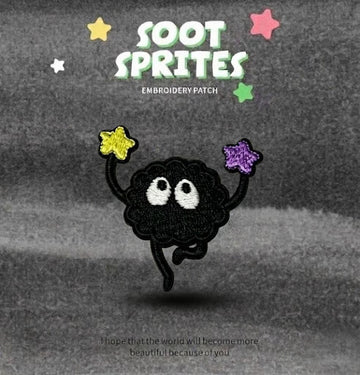 soot sprite holding purple star overhead embroidered patch