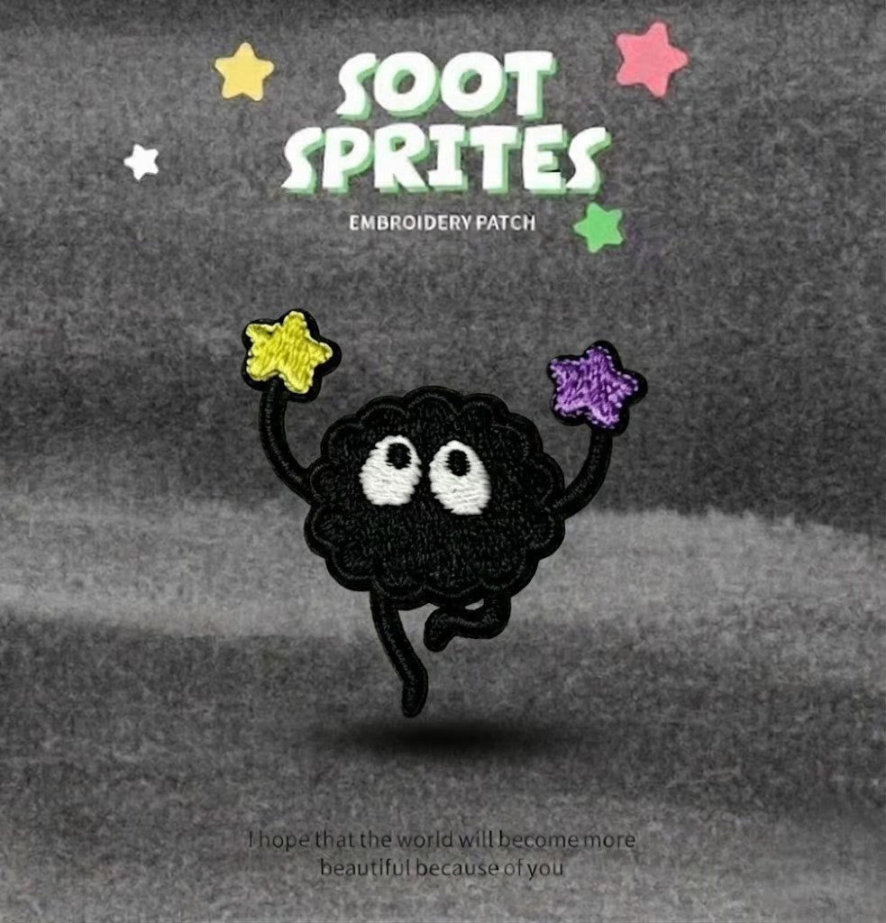 soot sprite holding purple star overhead embroidered patch