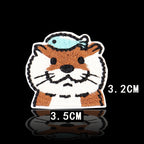 otter head with blue fish balanced on top embroidered patch