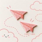 pink paper airplane embroidered stick-on patches — pair of rose pink satin embroidery paper planes with deep pink fold crease detail 33x18mm