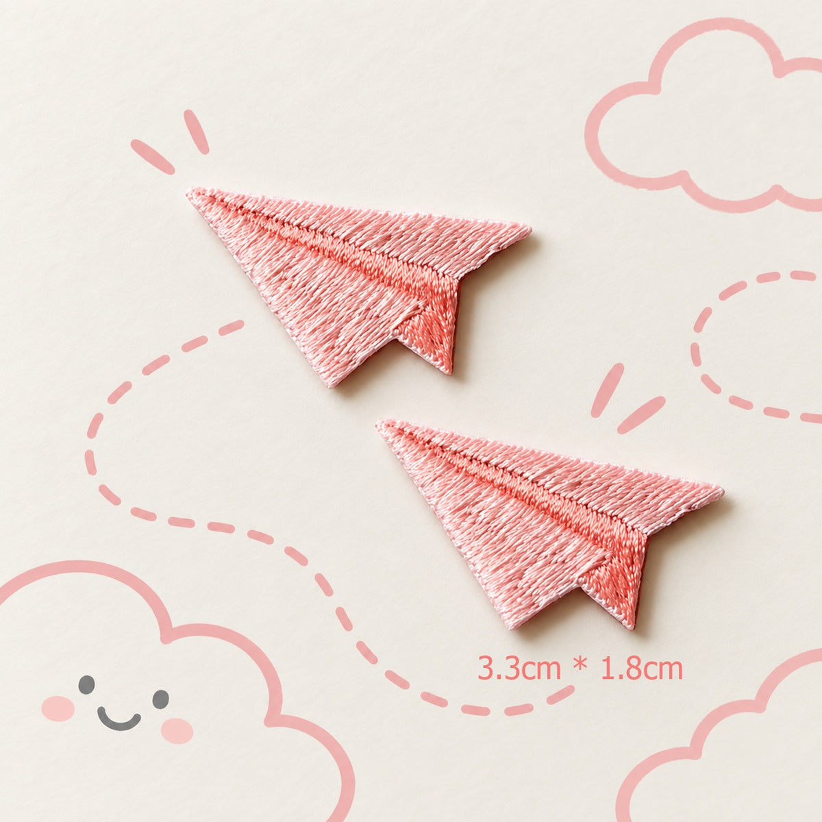pink paper airplane embroidered stick-on patches — pair of rose pink satin embroidery paper planes with deep pink fold crease detail 33x18mm