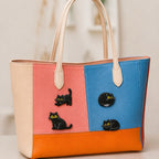multiple black cat expressions embroidered stick-on patches on canvas tote bag — different poses
