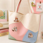 red panda raccoon and bunny stuck in milk tea jam and matcha jar stick-on patches decorating a pink blue and mint color-block leather handbag