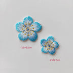 Matching cherry blossom patches in two sizes with blue petal edges and gold-tone stamens
