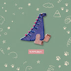 purple Spinosaurus kawaii embroidered stick-on patch — tall slim purple dinosaur with colorful dorsal fin long neck and gentle expression