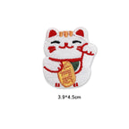 white lucky cat with raised paw and gold coin embroidered patch
