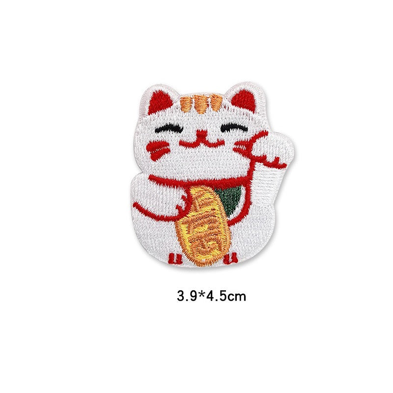 white lucky cat with raised paw and gold coin embroidered patch