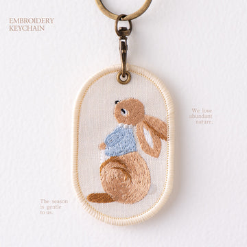 looking up storybook bunny double-sided embroidered keychain charm