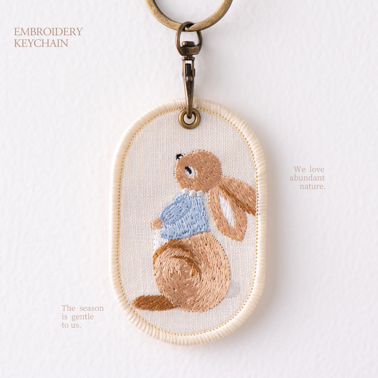 looking up storybook bunny double-sided embroidered keychain charm